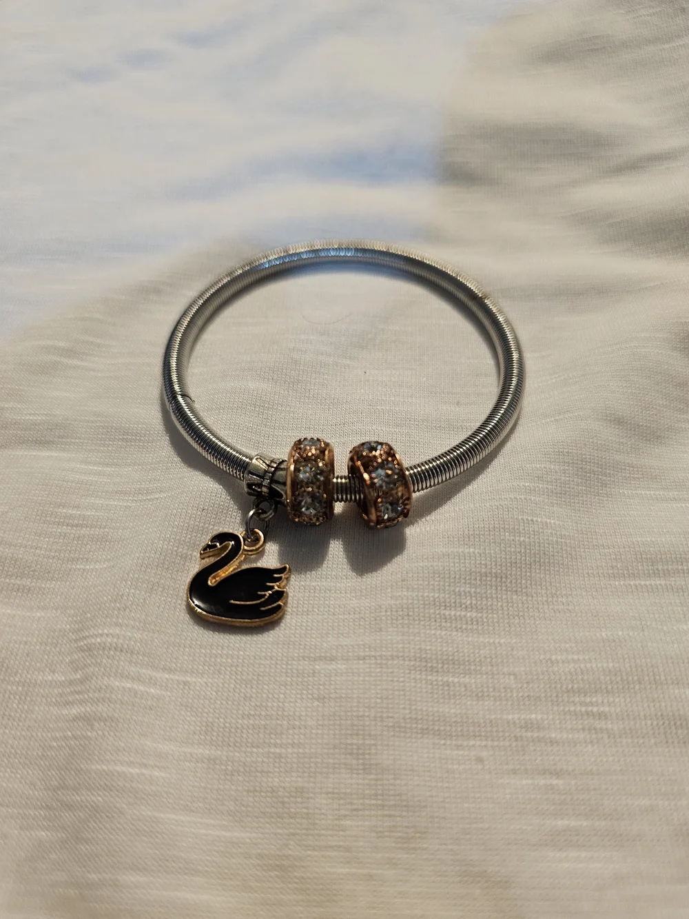 Elegant Silver-Tone Bracelet with Rose Gold Crystal Beads and Swan Charm